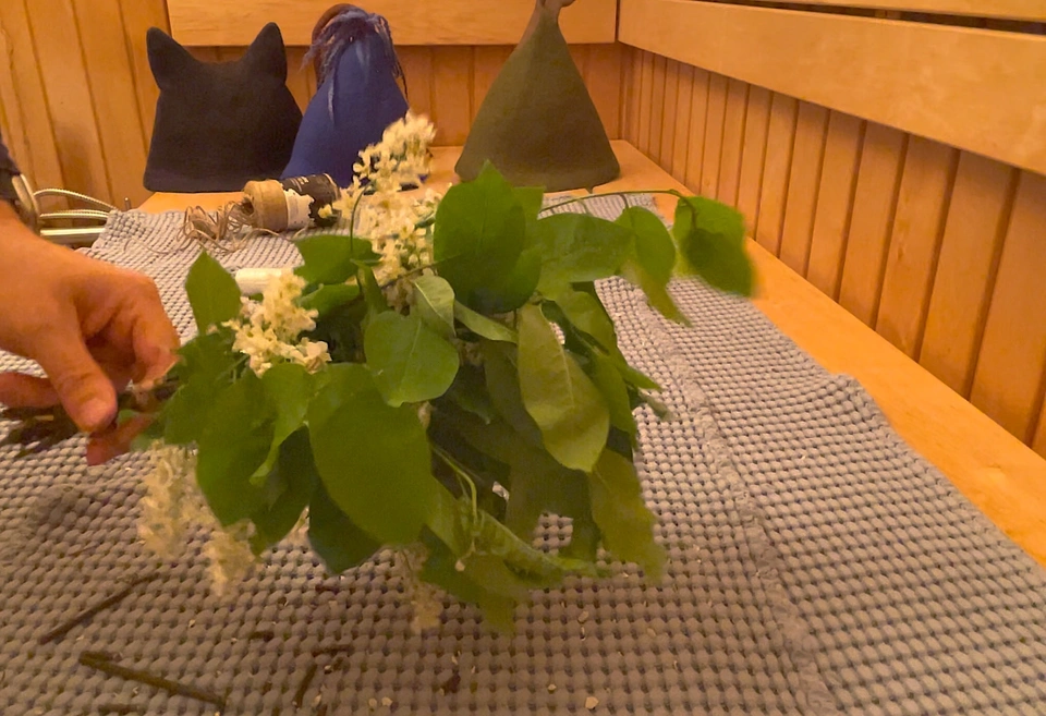 &ldquo;A freshly made bird cherry sauna whisk with white blossoms, showing a tightly wrapped handle&rdquo;
